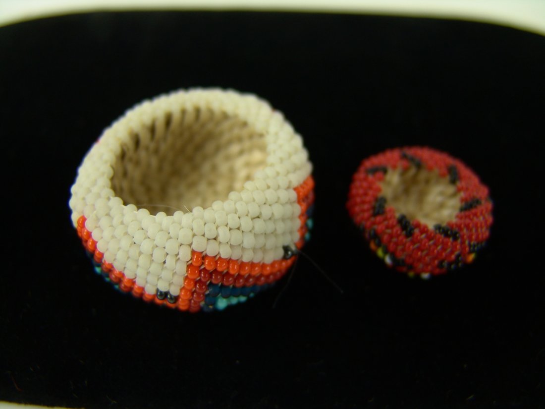 2 Miniature Beaded Baskets: Pair of very fine miniature Paiute/Shoshone beaded baskets by Jenny Dick. Very good condition. Size: Circa: 1960s