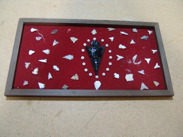 Arrowhead Frame: Large framed collection of modern arrowheads with an obsidian spearpoint. Size: 20" x 11" Circa: