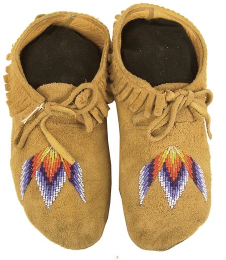 Plateau Beaded Moccasins: Classic design commercial buckskin moccasins with traditional designs beaded on the vamps. Very good condition. Size: 10" Circa: Late 1900s