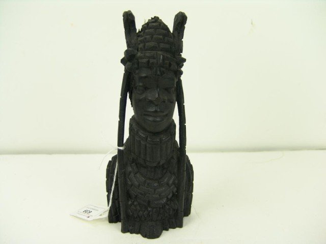 African Wood Carving: Fine ebony sculpture of a human with long hair ornaments. Size: 8" x 4" Circa: 1970s