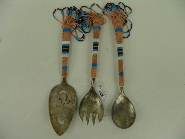 Beaded Serving Set: Collection of 3 antique like-patterned silverplate utensils; spoon, fork, and pie wedge - covered with more recent beading. Very good condition. Circa: Various ages Size: 9-1/2" longest