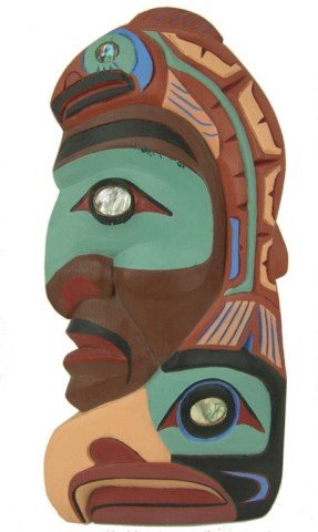 Northwest Coast Carving - Ed Williams: Beautiful hand carved and painted Squamish wall hanging "Salmon - Fisherman" with inlaid abalone eyes. Very good condition. Circa: 1980s Size: 8" x 17"