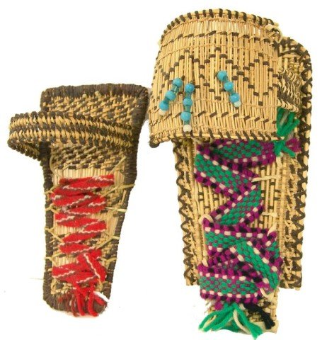 2 Mono Cradles: Pair of hand woven miniature basketry cradleboards, each with sun shades and red fern trim. Very good condition. Circa: Late1900s Size: 12" x 6" x 5" largest
