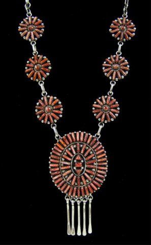 Zuni Necklace: Very fine all silver needlepoint cluster segment necklace and matching earrings with 165 hand cut and set spiney oyster stones. Excellent condition, hallmarked with a feather(?). Circa: Late 1900s Siz