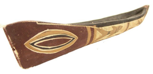 Wooden Toy Canoe: Hand carved and painted toy canoe made of very light wood, probably Oceanic(?). Very good condition. Circa: Mid to late 1900s Size: 3-1/2" x 26