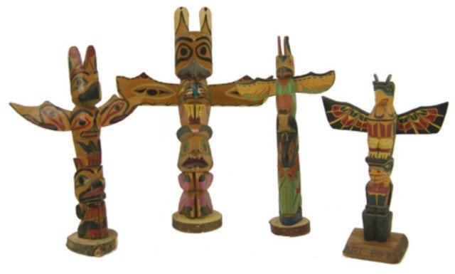 4 Northwest Coast Model Totem Poles: Collection of vintage hand carved and painted cedar tourist totem poles all in very good condition with nice patina, one marked "Albert Bay, BC," one marked "Genuine Indian Made." Very good condition.