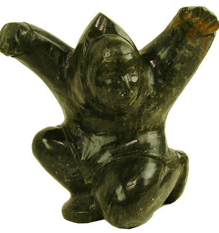 Eskimo Soapstone Carving - Kayutak: Fine hand carved dark green soapstone sculpture "Dancer." Very good condition. Circa: Late 1900s Size: 7-1/2" x 7"
