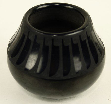 San Ildefonso Pottery Jar: Very fine black-on-black pottery jar with classic feather design on shoulder. Very good condition. This is marked "Marie & Julian"(?)Circa: Mid 1900s Size: 3-1/2" x 4"
