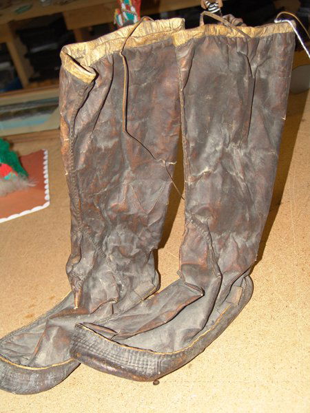 Eskimo Boots: Very rare pair of dark Eskimo sealskin boots with formed soles and seal gut thread. Good condition. Size: 10"