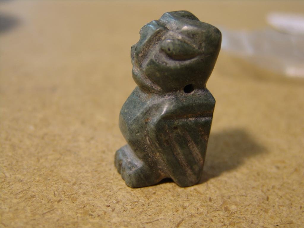 Carved Pendant: Hand carved totemic green stone bird pendant, possibly jade or soapstone. Circa: Mid 1900s Size: 2" x 1"