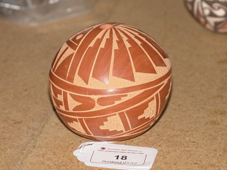 Jemez Pot: Jemez redware seed pot with sgraffito finish signed Chinana. Size: 3" x 3"