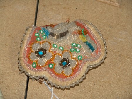 Iroquois Beaded Whimsey: Classic and gaudy tourist wall hanging "From Niagara Falls" with traditional raised beadwork. Good condition. Circa: 1900 Size: 5" x 4"