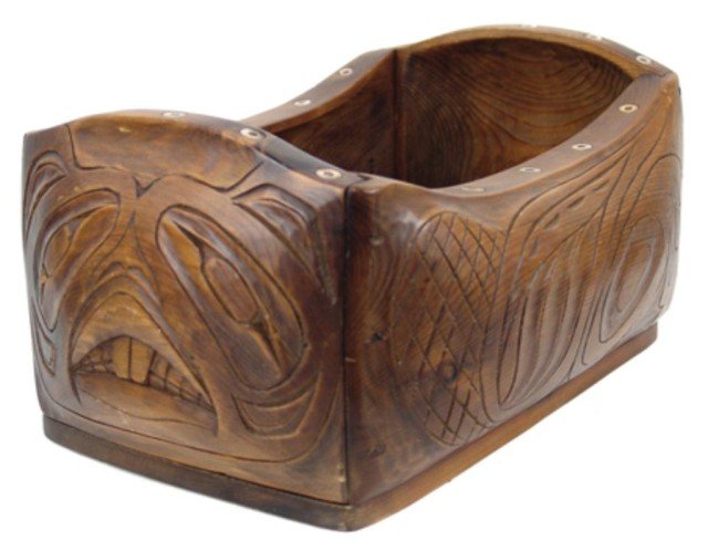 Northwest Coast Carved Box: Very finely carved cedar box with concave sides and ends, inlaid bone discs, and rare beaver design. Very good condition, nice patina. Circa: 1960s Size: 15" x 10" x 7-1/2"