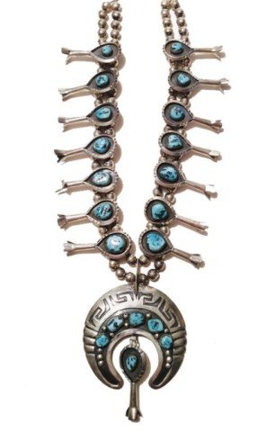 Navajo Squash Blossom: Beautiful heavy sterling silver Navajo squash blossom with shadow boxed natural Nevada turquoise cabazons and naja with drop. Circa: 1974 Size: 25", Naja 3" x 3"