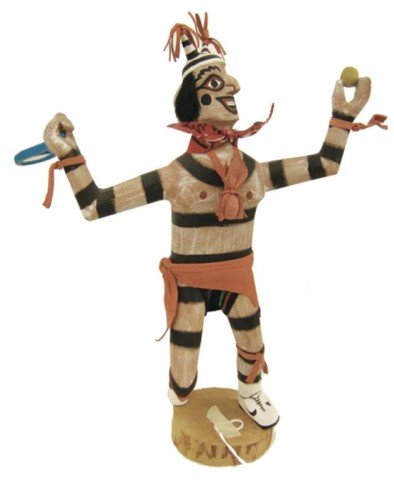 Hopi Katsina Carving- F. Begay: Traditional hand carved and painted cottonwood root "Koshare Hano" clown doll holding tennis racquet. Very good condition. Circa: Late 1900s Size: 11"
