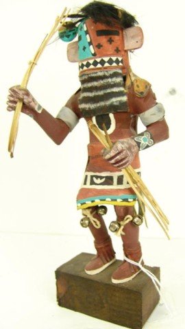 Hopi Katsina Carving - A. David: Traditional older hand carved and painted cottonwood root doll "He-He-Oh" with reeds and dance bells. Very good condition, minor repairs. Circa: Mid 1900s Size: 11" x 3-1/2"