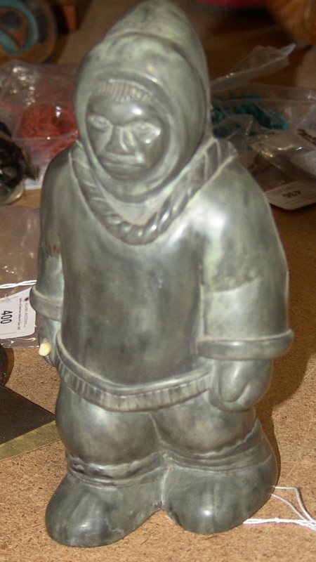 Eskimo Carved Figure: Eskimo carved soapstone figure with broken spear. 8-1/2" x 4-1/4"
