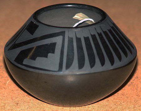 San Ildefonso pottery- Santana & Adam: Very fine San Ildefonso, black-on-black pot with feather design, signed Santana & Adam. 3 x 5"