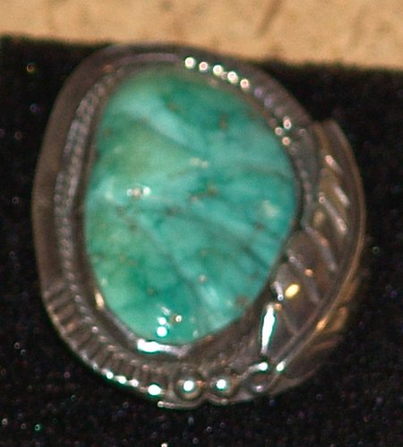 Turquoise Ring: Excellent Navajo silver ring with large carved Lone Mountain turquoise cabazon in leaf-in-rope bezel with file work. Ring 8-1/2