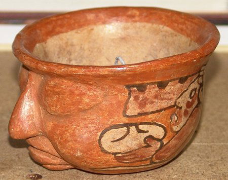 Mayan Pot: Mayan pictorial polychrome pot with human face effigy. 2-1/2" x 3-3/4"