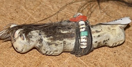 Coyote Fetish: A rare Zuni hand carved stone coyote fetish with medicine bundle. 3 x 1"
