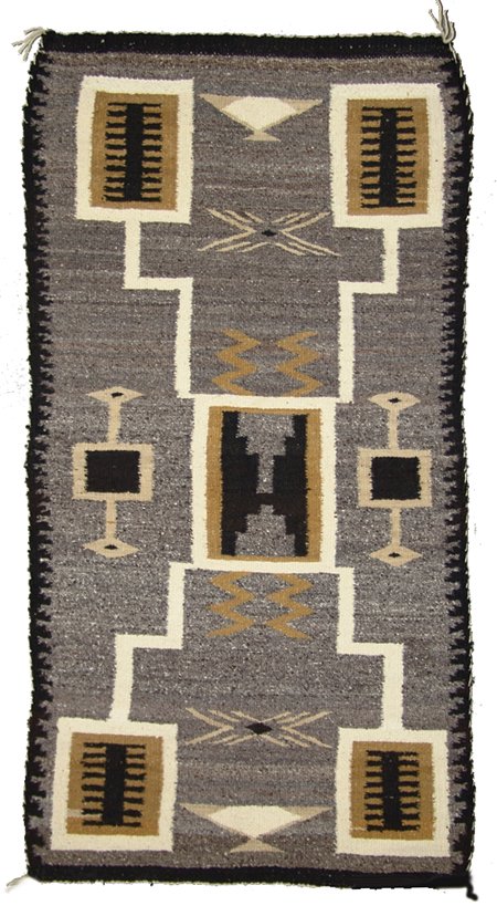 Navajo Rug/Weaving: 1960s, Classic hand spun storm pattern rug with water bug and other geometric symbols on a heather field. Very good condition. 52" x 28"