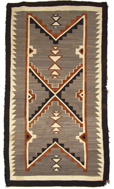 Navajo Rug/Weaving: 1940s, Large, finer weave Teec Nos Pos rug with outlined geometric designs, serrated edges, and black border. Very good condition, with some edge damage and light soiling. 79" x 42"