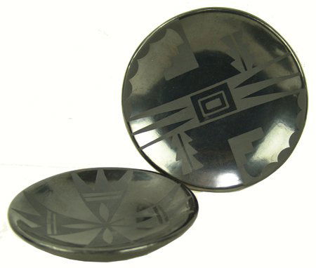 2 San Ildefonso Dishes - Maria Poveka & Santana: Mid 1900s, Pair of traditional black-on-black plates, the smaller signed "Marie & Santana," the larger "Maria Poveka." 1" x 5-1/4", 1" x 6"