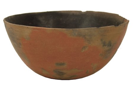 Salado Pottery Bowl: Prehistoric, Classic and large, flared onionskin bowl, orange with black interior. Intact with stress crack that has been glued. 4-3/4" x 10"