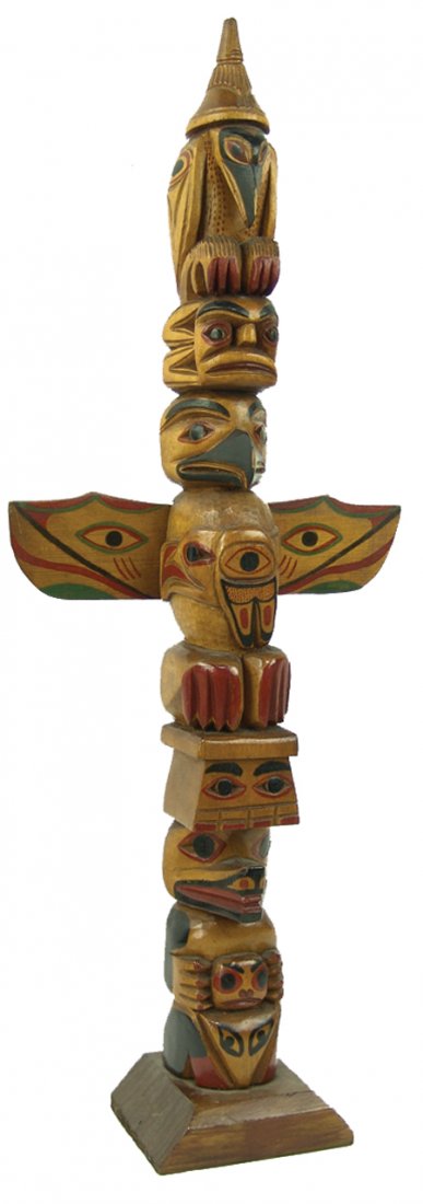 Northwest Coast Totem Pole: Mid 1900s, Deep relief carved, vintage five- or six-figure cedar model totem pole with great patina. A beautiful tourist piece from the 50s. 23-3/4" x 9"