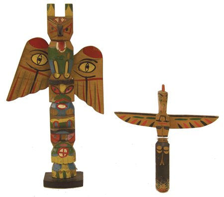 2 Northwest Coast Totem Poles: Mid 1900s, Pair of hand carved and painted vintage tourist poles, the smaller one marked "Hand carved by Kwakiutl Indians, British Columbia." Both very good condition. 6" & 10-1/2"