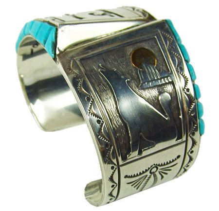 Zuni Inlay Bracelet: 1970s, Very fine quality hollow work all silver bracelet with traditional Pueblo symbols, howling coyote with brass moon, and two rows of raised inlay turquoise stones. Excellent condition. Retail $80