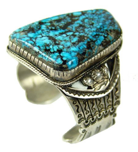 Navajo Bracelet - Michael Perez (White Buffalo): 1980s, Outstanding hand wrought hand stamped heavy gauge silver bracelet with a huge 320 carat Blue Diamond turquoise stone. Very good condition. 5-1/2" + 3/4" x 2-1/4"