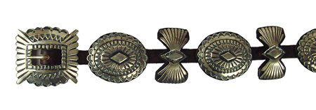 Navajo Concho Belt: 1989, Beautiful, heavy gauge, hand-stamped all-silver concho belt with bow tie buckle. Commissioned by James Reid, limited, SF (with their hallmark) and signed by the maker, "AH". Very good condition,