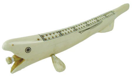 Eskimo Ivory Cribbage Board: Mid/Late 1900s, Fine hand carved cribbage board in rare fish design with scrimshaw details and a removable peg in the mouth where the gaming pegs can be stored. Very good condition. 2-1/4" x 11-1/4"