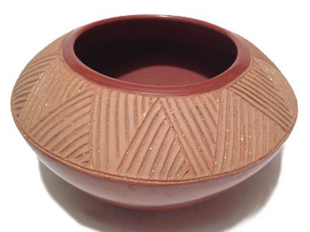 San Juan Bowl: Ca. 1984, Nice redware bowl with cream rim and triangular grooved motif. With hallmark. 4-1/4" x 7-1/2"