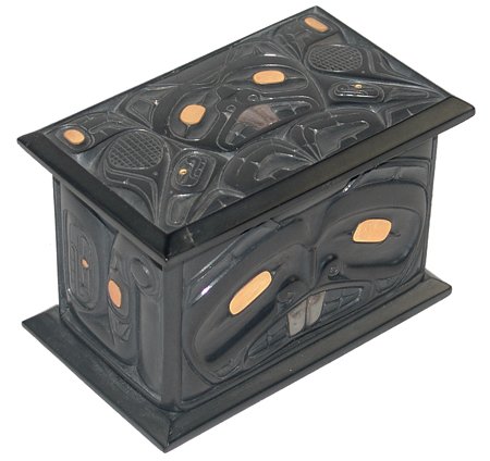 Haida Argillite Box - Ron Russ: Ca. 1982, Exquisite hand-carved argillite "bentwood box," carved in beaver motif with gold inlaid feathers. Lid has been professionally repaired and piece is in very good condition. 3-1/2" x 5" x 3"