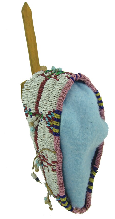 Sioux Toy Cradle: Mid 1900s, Fine sinew sewn and lazy stitch beaded miniature cradleboard with buckskin body, rawhide back, and traditional slats (one broken) otherwise very good condition. 2" x 5-1/2" x 3"