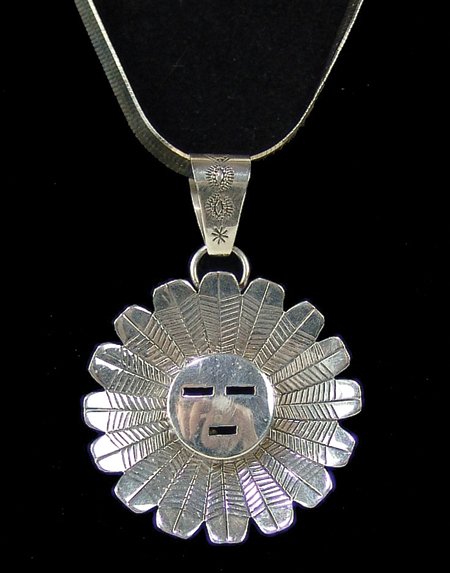 Navajo Necklace - Jeff James Jr.: Late 1900s, Very fine hand wrought silver sunface pendant on a beautiful 18" silver serpentine chain. Very good condition. Total weight 1.64 ozt. 18", 3-1/4" x 2-1/4"