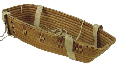 Salish Cradle Basket: Ca. 1900, Rare intact full-sized Thompson River basketry cradle with traditional imbricated designs on the exterior. Very good condition, comes with an old camp blanket. 4-1/2" x 26" x 11"