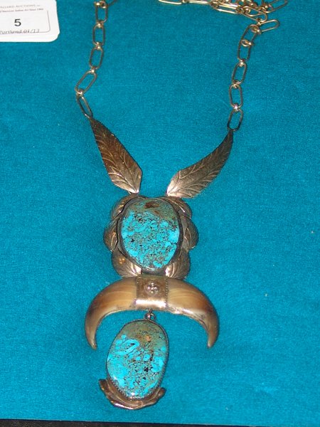 Navajo Necklace: 1970s, Original design hand wrought all silver pendant with two matching Royston (?) turquoise stones and two polished bear claws, connected by a 14KT gold band. Signed "JB." Very good condition. 22" 
