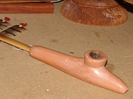 Hopi Pipe: 1950, Rare Hopi pottery pipe with unusual bamboo stem. The pipe has been broken and glued back together. Pipe 9"