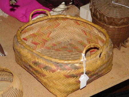 River Cane Basket: Ca. 1910, Rare Cherokee polychrome River Cane basket with handles intact. Very good condition, with one area of breakage. 13" x 13" x 6"