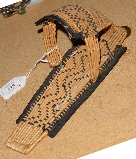 Basketry Toy Cradle: 1930s, Paiute basketry toy cradleboard. Good condition. 3-1/2" x 10"