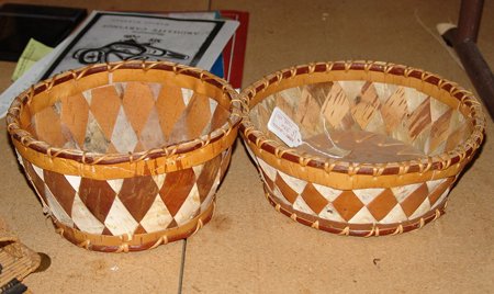 2 Woodlands Baskets: Mid 1900s, Two Woodlands birch bark baskets, made by Marie Cleveland Wood. Both in good condition. Largest 10" x 3-1/2"