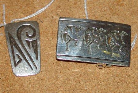 Two Hopi Overlay Pieces: Pair of Hopi overlay pieces; a square buckle, and the smaller piece is either a clip or a bolo tie slide by Manuel Hoyungowa. Largest 2" x 1-1/4"