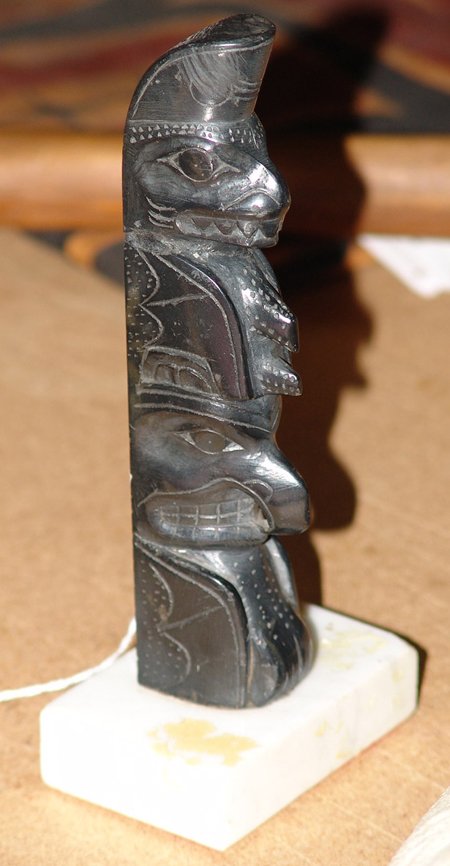 Haida Argillite Totem Pole: 1960s, Classic hand carved Haida argillite two-figure totem pole on a marble base. Very good condition with a nearly invisible repair at the top. 6-1/4" tall + base
