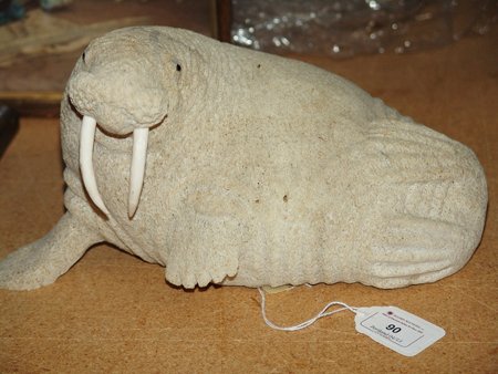Eskimo Bone Carving- Lewis Syakitan: Ca. 1970s, Beautiful hand carved whale bone sculpture with baleen eyes and carved bone tusks, made by Lewis Syakitan. Very good condition. 6" x 11" x 6"