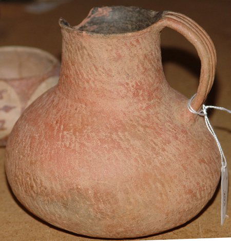 Anasazi Pottery Pitcher: Prehistoric, Classic Anasazi redware thumbnail corrugated pitcher with some restoration and a little rim damage. 6-1/2" x 6"
