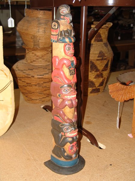 NWC Totem Pole: Beautiful hand carved and painted northwest coast totem pole with at least five figures. Very good condition. 21" x 5" x 4-1/2"